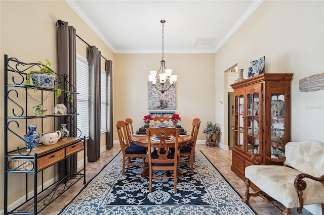 dining area with tile patterned flooring, ornamental molding, and a chandelier