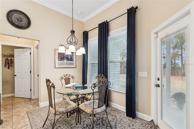 tiled dining area featuring a chandelier, a wealth of natural light, and crown molding