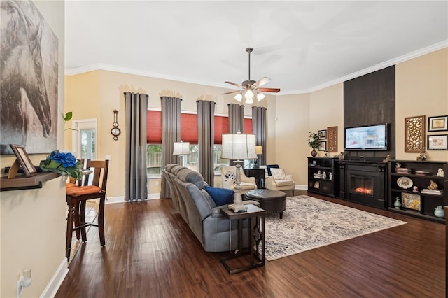 living room featuring crown molding, ceiling fan, and dark wood-type flooring