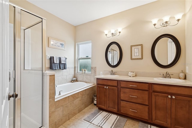 bathroom featuring tile patterned flooring, vanity, and plus walk in shower