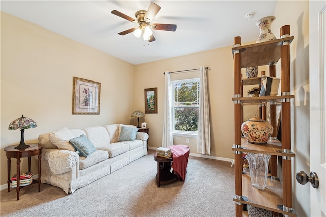 living room featuring carpet flooring and ceiling fan