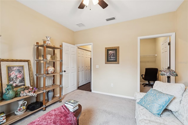 sitting room featuring carpet flooring and ceiling fan