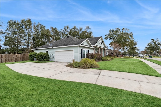 view of side of home featuring a lawn and a garage