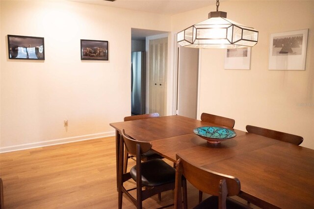 dining space featuring light wood-type flooring