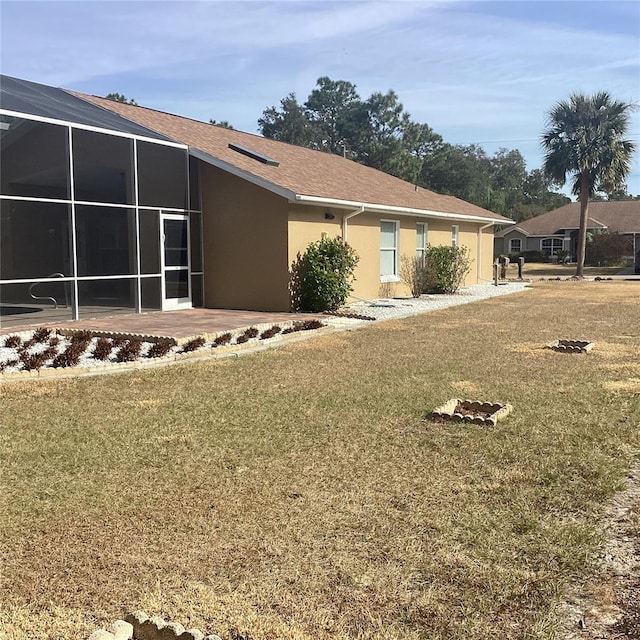 view of property exterior with a lawn