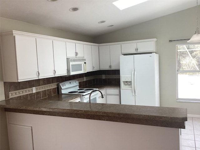 kitchen featuring white cabinetry, white appliances, kitchen peninsula, and tasteful backsplash