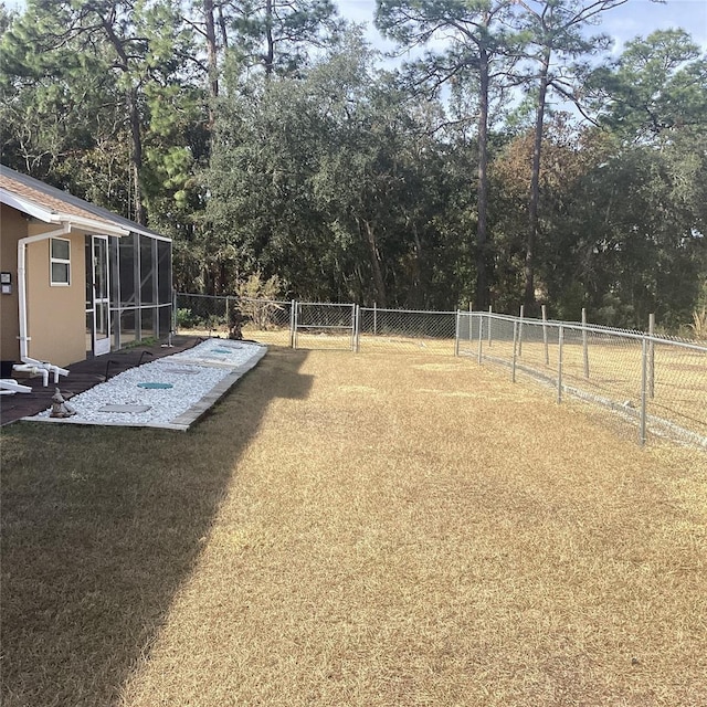 view of yard featuring a sunroom