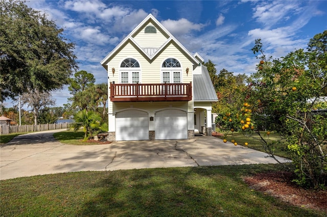 view of front of house featuring a garage and a front lawn