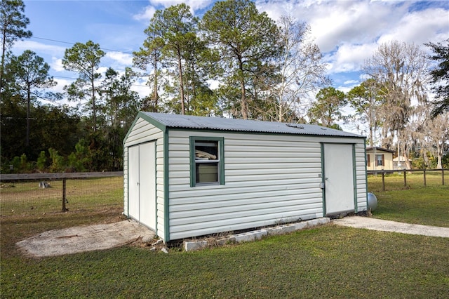 view of outdoor structure with a lawn