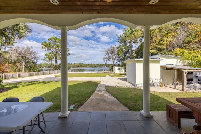 view of patio with a water view