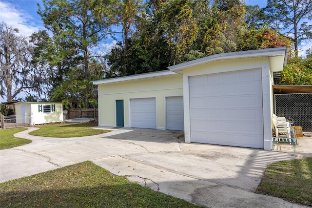 garage with a lawn