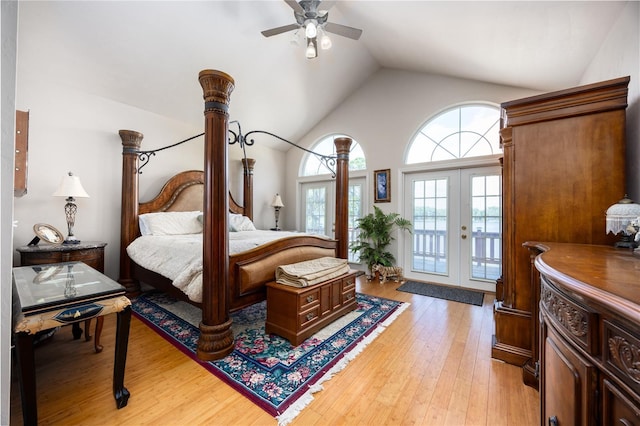 bedroom featuring access to outside, french doors, vaulted ceiling, light hardwood / wood-style flooring, and ceiling fan