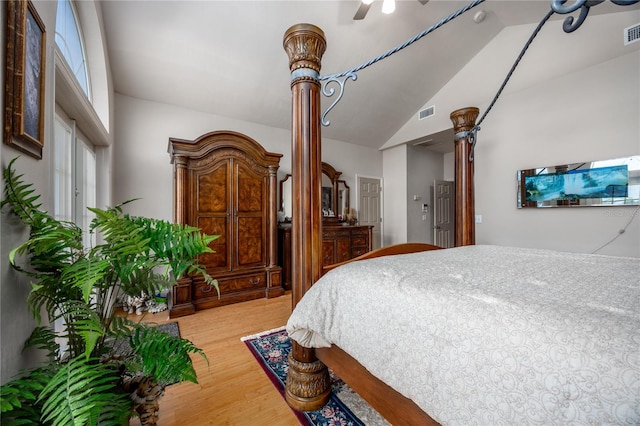 bedroom featuring hardwood / wood-style floors, ceiling fan, and high vaulted ceiling