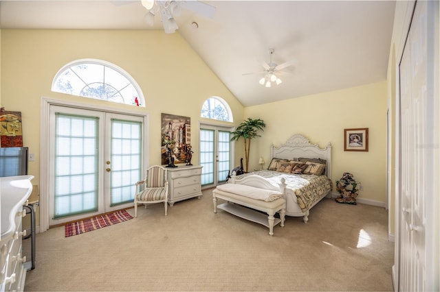 carpeted bedroom featuring ceiling fan, access to outside, high vaulted ceiling, and french doors