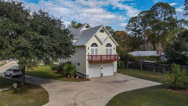 view of front of property with a front lawn and a garage