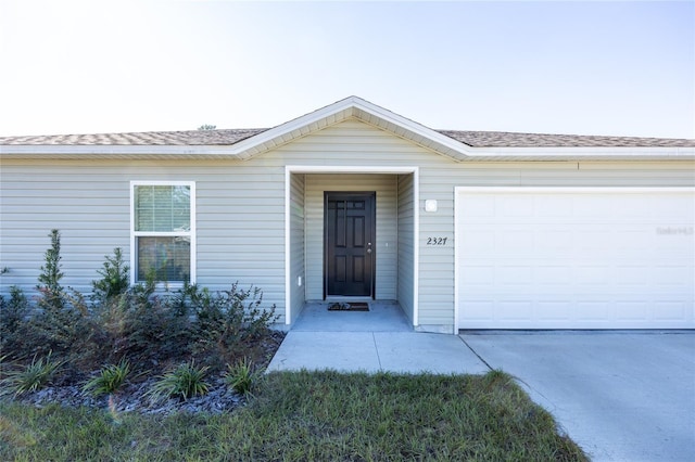 view of front of property with a garage