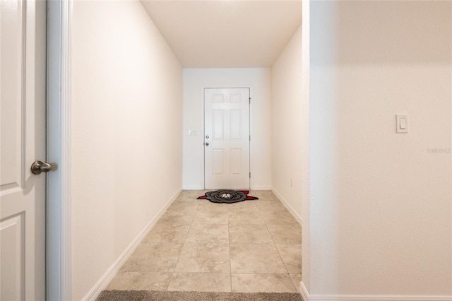 doorway featuring light tile patterned floors