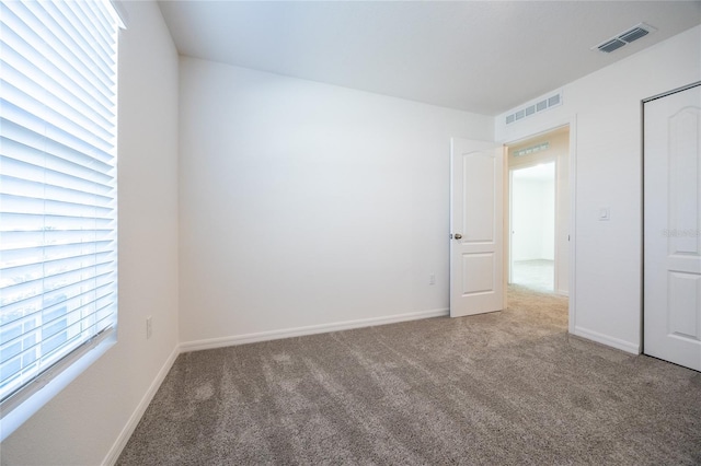 empty room featuring carpet flooring