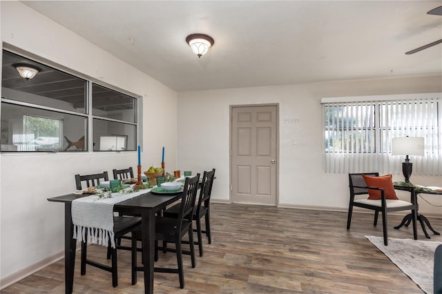 dining room with ceiling fan, dark hardwood / wood-style flooring, and a healthy amount of sunlight