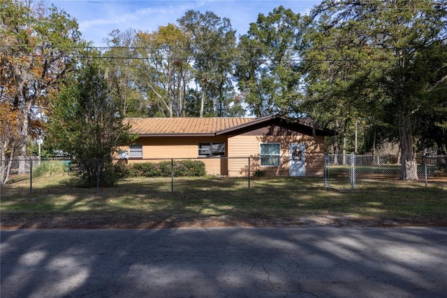 ranch-style house with a front lawn