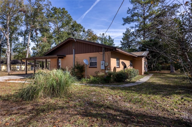 view of property exterior featuring a carport