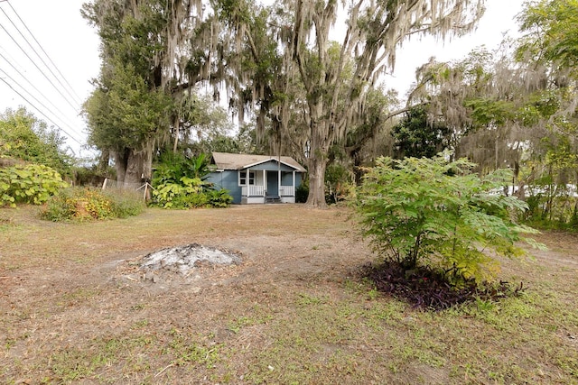 view of yard featuring covered porch