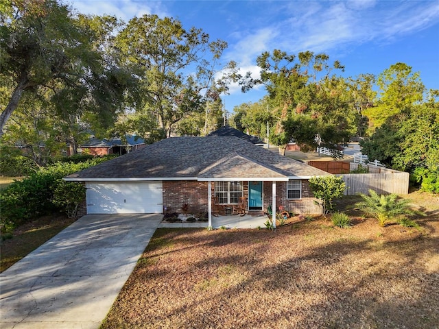 single story home featuring a garage