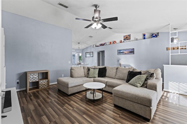 living room featuring ceiling fan, dark wood-type flooring, and vaulted ceiling