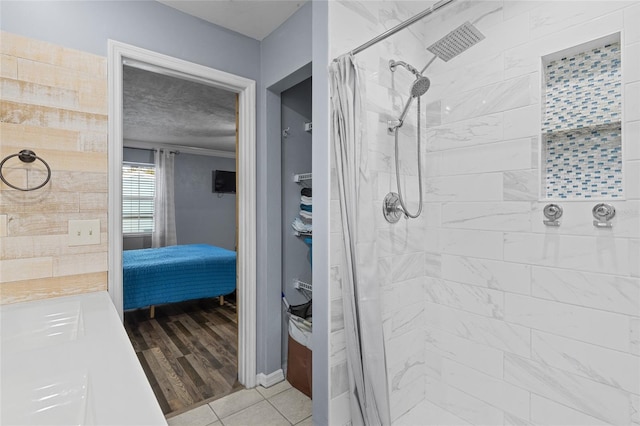 bathroom featuring hardwood / wood-style flooring and a shower with curtain