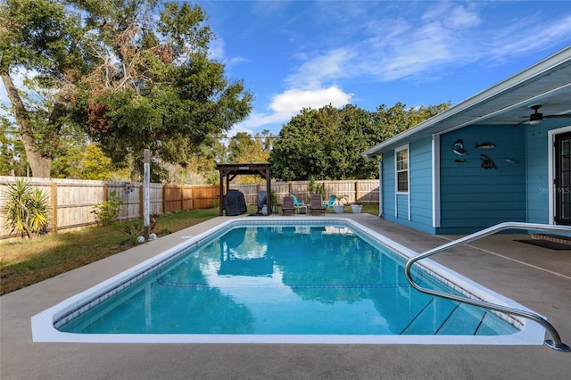 view of swimming pool featuring ceiling fan