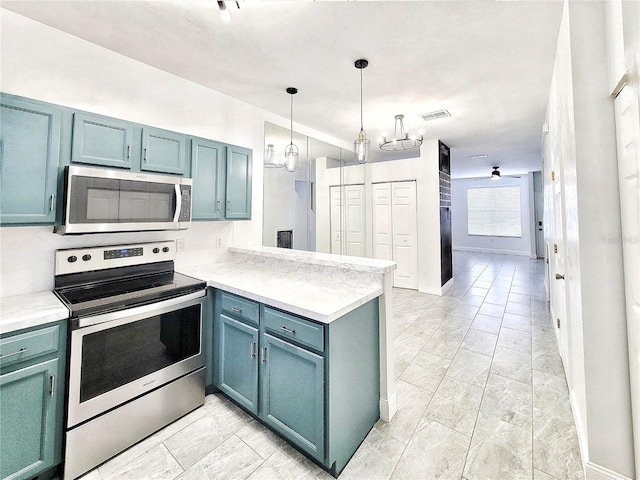 kitchen featuring kitchen peninsula, appliances with stainless steel finishes, tasteful backsplash, ceiling fan, and pendant lighting