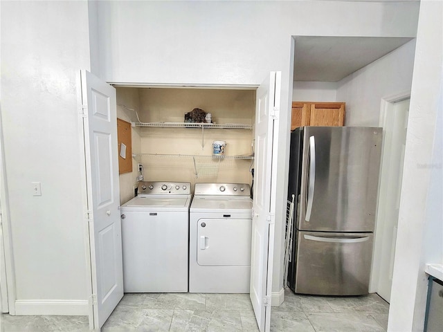 washroom with washing machine and dryer