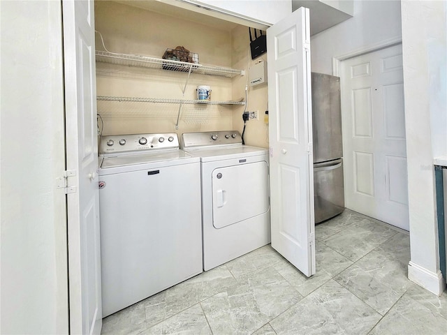 laundry area with washing machine and clothes dryer