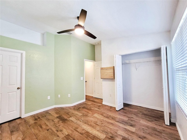 unfurnished bedroom with ceiling fan and hardwood / wood-style floors