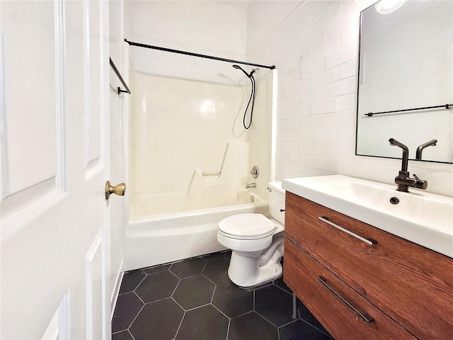 full bathroom with vanity,  shower combination, tile patterned floors, toilet, and tile walls