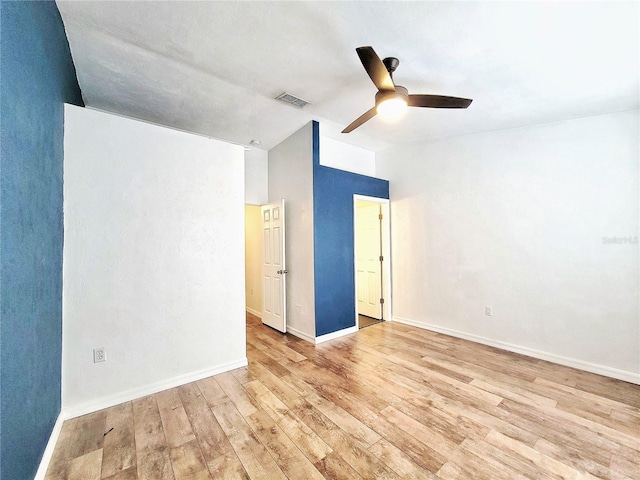 unfurnished room with ceiling fan and light hardwood / wood-style floors