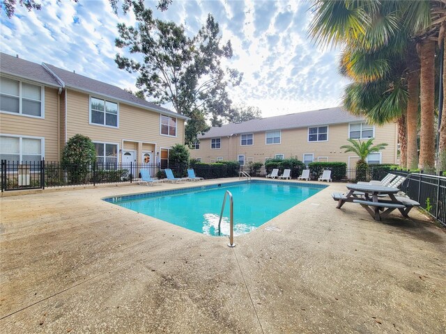 view of swimming pool featuring a patio