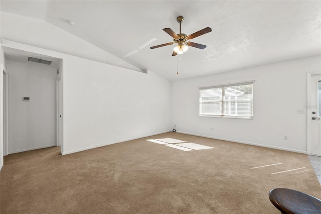 interior space with ceiling fan, light carpet, and vaulted ceiling