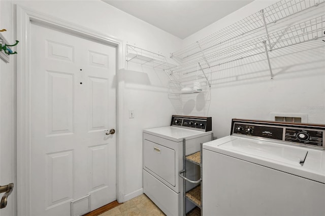 laundry area with washer and clothes dryer