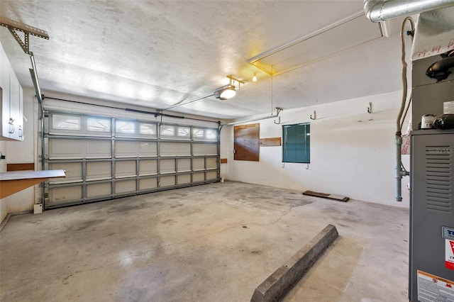 garage with heating unit and a garage door opener