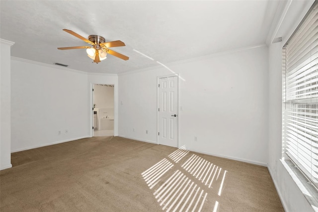 unfurnished room with light carpet, ceiling fan, and ornamental molding