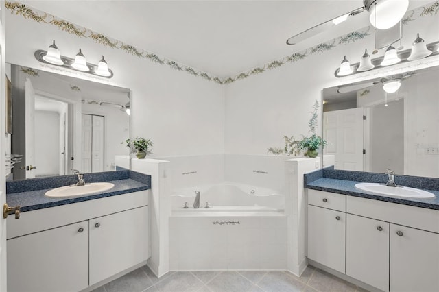 bathroom featuring vanity, tiled bath, and tile patterned floors