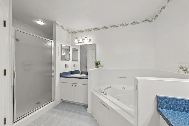 bathroom with tile patterned flooring, vanity, and separate shower and tub