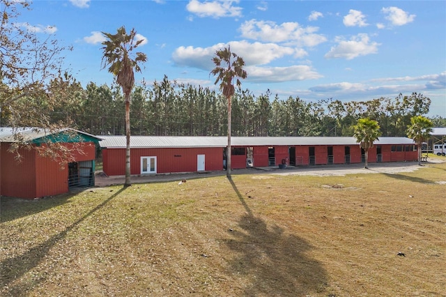 back of house with a lawn