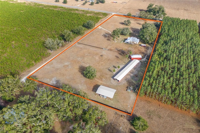 birds eye view of property with a rural view