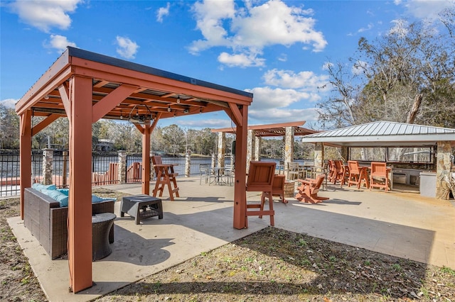 view of patio with a gazebo and a water view