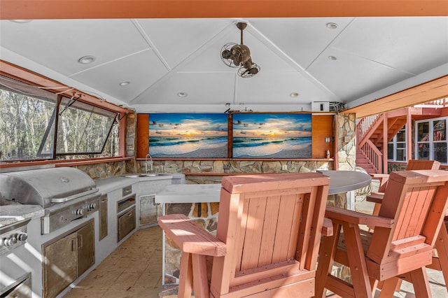 view of patio / terrace with exterior kitchen, sink, and grilling area