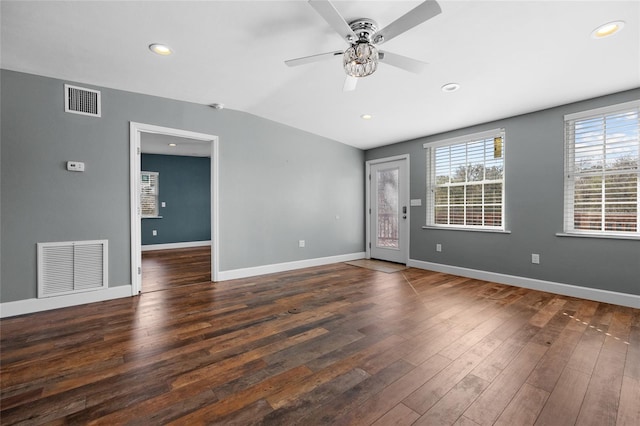 empty room with ceiling fan and dark wood-type flooring