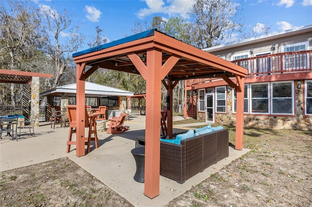 view of patio / terrace featuring a gazebo and an outdoor hangout area