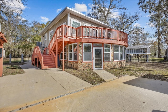 view of front of home with a wooden deck